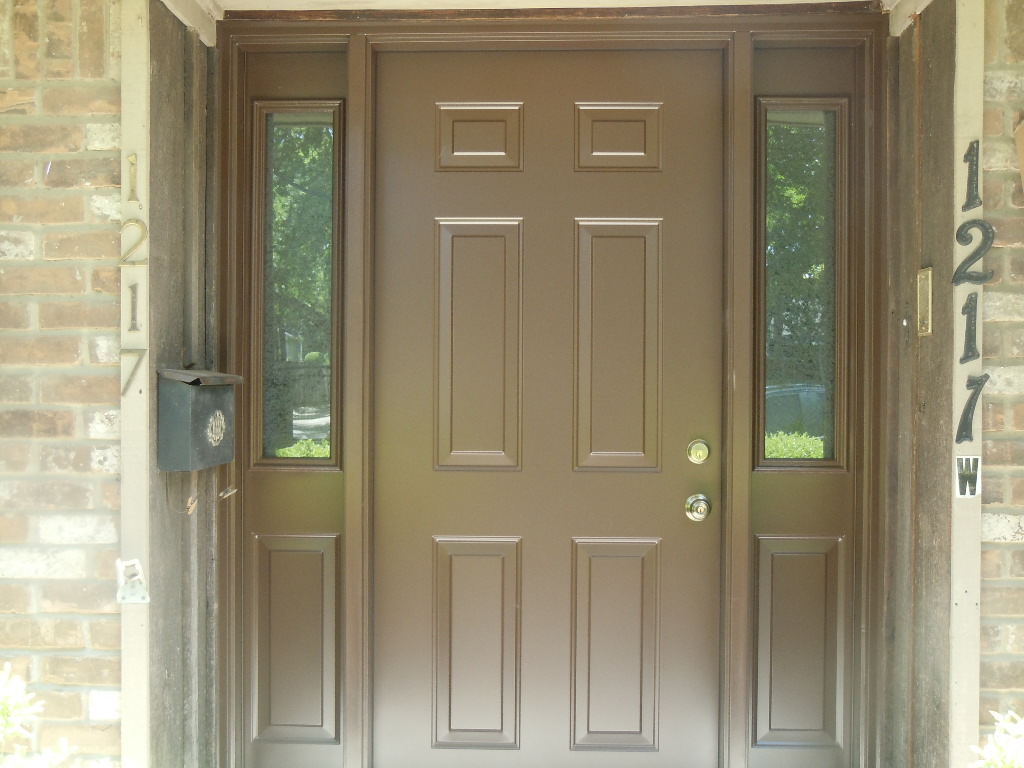 Elegant steel entry doors with arched design and decorative metalwork